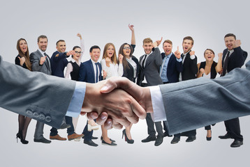 Business handshake and happy energetik business people