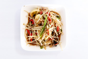 Thai food papaya salad on white dish