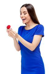 Beautiful woman holding heart shaped box with ring