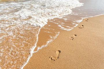 Footsteps on the beach, summer lifestyle