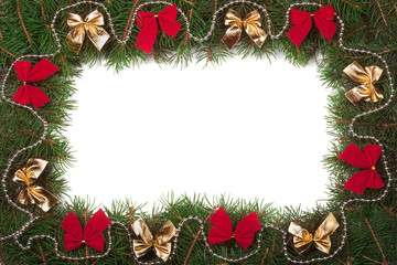 Christmas frame made of fir branches decorated with bows isolated on white background