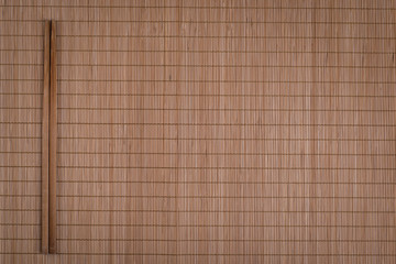 chopsticks on plain natural bamboo background