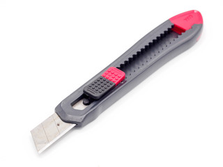 Black and red plastic cutter knife isolated