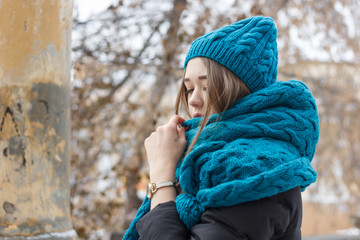 Beautiful girl on the nature in the winter outside in winter hat