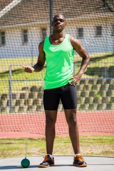 Obraz premium Portrait of athlete holding hammer throw