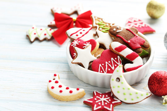 Christmas cookies in bowl on a blue wooden table