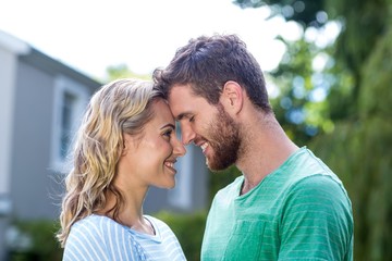 Fototapeta premium Couple touching head in yard