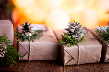 Naklejka na ściany i meble Decorated gift boxes and garland on the wooden background