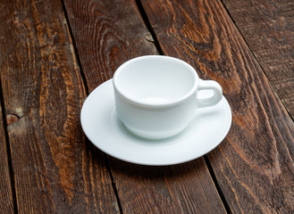 Empty coffe cup on dark table