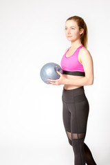 young woman with ball, studio shot