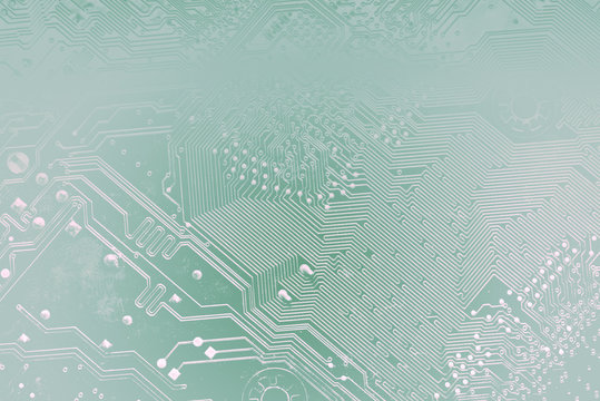 Circuit board or motherboard toned into light transparent silhouettes in blue colors. Tech science background suitable for your it technology business presentation.