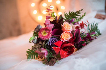 Beautiful Weding bouquet of different flowers in bride hands