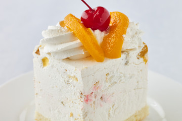 Cake dessert with peach and cherry