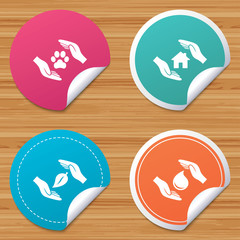 Round stickers or website banners. Hands insurance icons. Shelter for pets dogs symbol. Save water drop symbol. House property insurance sign. Circle badges with bended corner. Vector