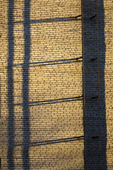 Fire escape on a wall of the brick multi storey building...