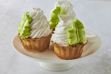 Air cake in a basket on a wooden background