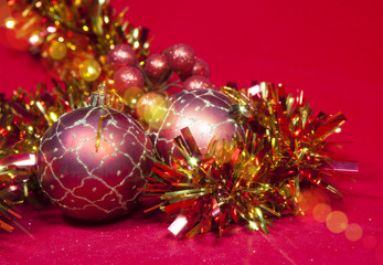 New Year's composition on a red background - ball and ribbon