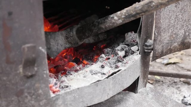 Serbian rakija boiler fire in slow motion distilled process procedure 1080p FullHD footage - Tree logs in metal tube burning as part of making alcoholic  slow-mo 1920X1080 HD video 