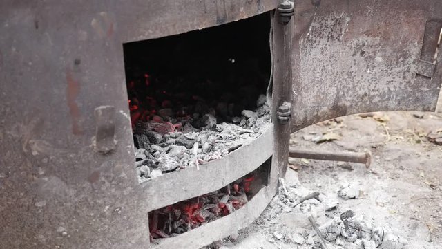 Slow motion Serbian rakija boiler fire in distilled process procedure 1080p FullHD footage - Tree logs in metal tube burning as part of making alcoholic hard liquor beverage 1920X1080 HD video 