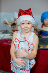 Obraz premium child baking christmas cookies