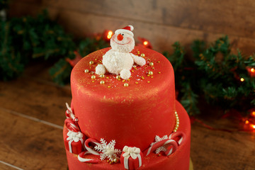 beautiful Christmas red cake on a wooden background
