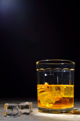 Scotch and light  on wooden background with copyspace. An old an