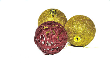 Three golden and red christmas balls.