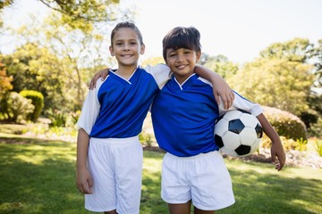 Portrait of two children smiling at camera 