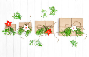 Fototapeta na wymiar Advent calendar gifts christmas decoration evergreen branches