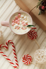 Obraz na płótnie Canvas big mug of hot cocoa and sweet christmas candy