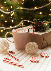 Fototapeta na wymiar big mug of hot cocoa and sweet christmas candy