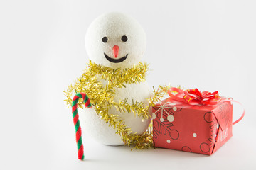 Gift box and snowman candy cane decoration isolated