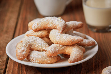 Vanillekipferl on a plate with milk