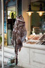 Giant angler on a hook sales in fish shop.