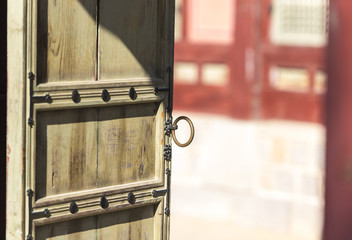 Asian wooden door in a small garden in Korea