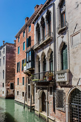 Canal with beautiful medieval facades. Venice, Italy.