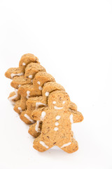 Gingerbread men cookies, on white background with copy-space.