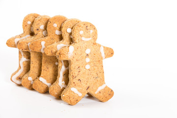 Gingerbread men cookies, on white background with copy-space