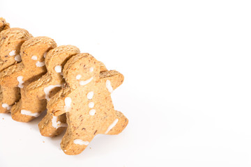 Gingerbread men cookies, on white background with copy-space.