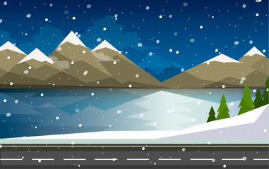 The winter landscape of forests, mountains, road and lake.