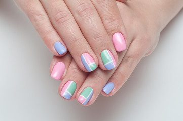 Рink, mint, lilac manicure with white stripes on the square nails