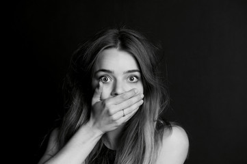 Speak no evil. The girl closes your mouth. Long hair