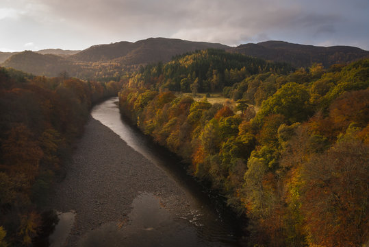 Looking down on the River Garry with the Autumnal trees lining it's banks. 