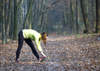 Sport woman doing outdoor cross training workout. Fitness in beautiful park