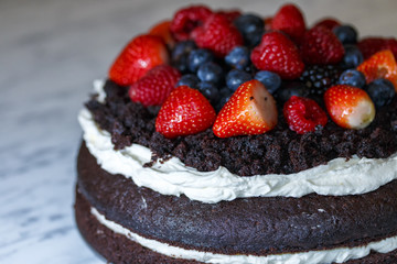 chocolate cake with fruit and whipped cream
