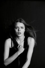 Naklejka premium Young beautiful girl builds faces. Hamming , fun