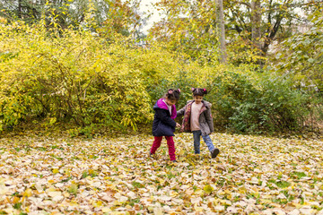 Fototapeta premium Little girls in autumn park