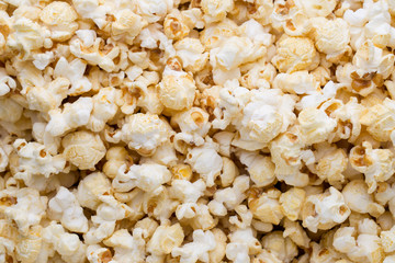 Popcorn background. Caramel sweet corn. Cinema snack.