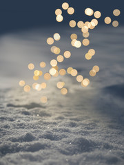 Moody glow of Christmas lights on fresh evening snow, background, copyspace