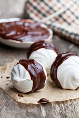 Homemade  white meringues with dark chocolate